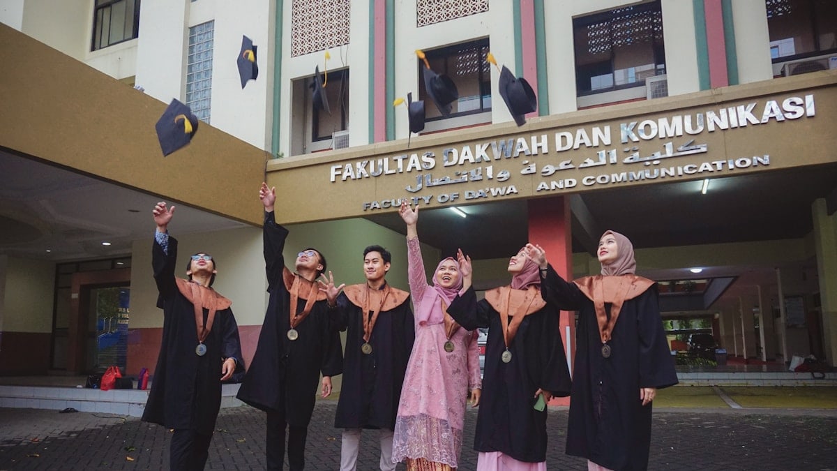 a group of people in black robes